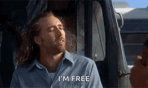 A Man In A Blue Shirt Says I 'M Free While Sitting In A Car GIF