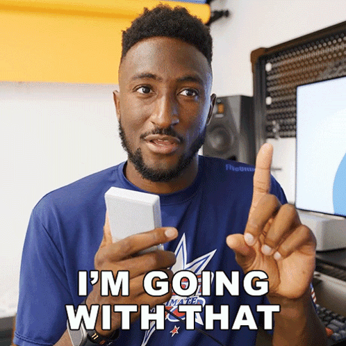 A Man In A Blue Shirt Says I 'M Going With That While Holding A Cell Phone GIF