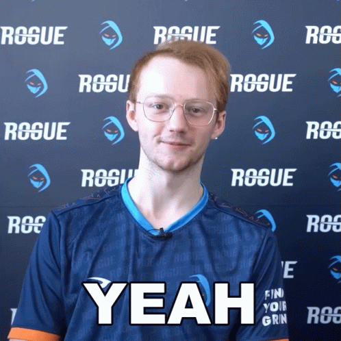 A Man In A Blue Shirt Says Yeah In Front Of A Rogue Wall GIF