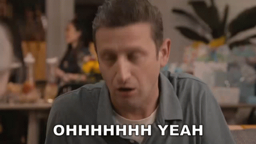 A Man In A Blue Shirt Says Yeah In White Letters GIF