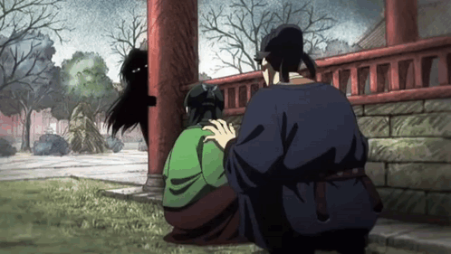 Man In Blue Shirt Next To Woman In Green Dress GIF