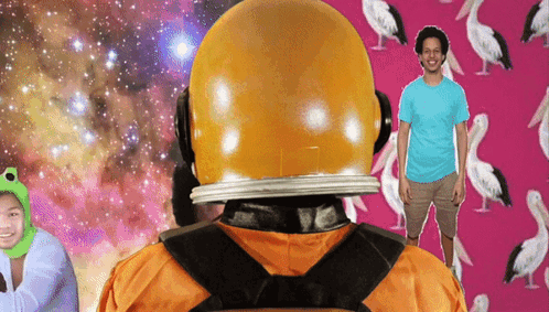 A Man In A Blue Shirt Stands In Front Of A Pink Background With Birds On It GIF