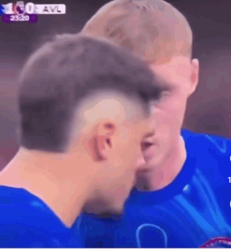 A Man In A Blue Shirt Talks To Another Man GIF