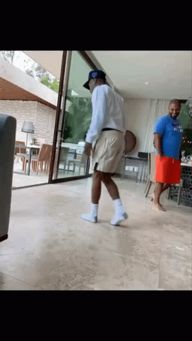 A Man In A Blue Shirt That Says ' Atlanta ' On It GIF