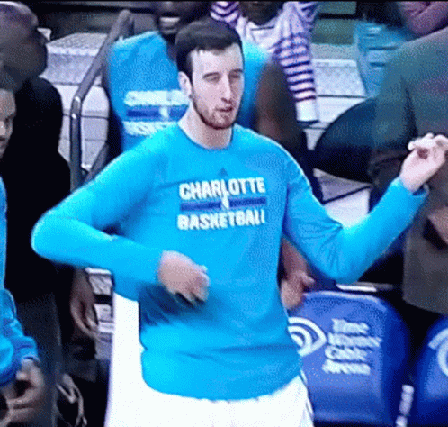A Man In A Blue Shirt That Says Charlotte Basketball On It GIF