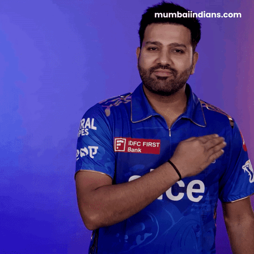 A Man In A Blue Shirt That Says Idfc First Bank On It GIF