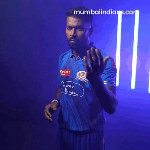 A Man In A Blue Shirt That Says Mumbai Indians GIF