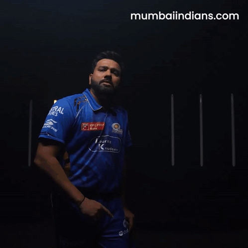 A Man In A Blue Shirt That Says Mumbaiindians.com On The Bottom GIF