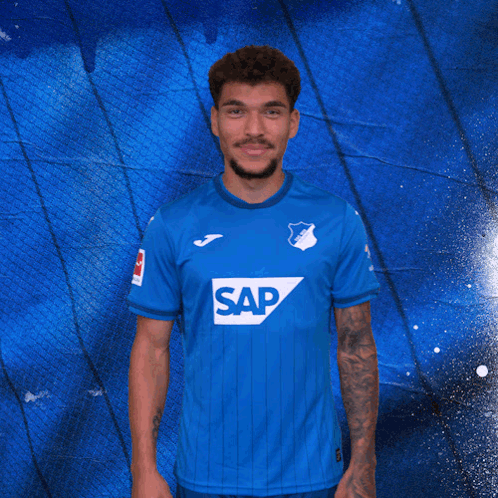 A Man In A Blue Shirt That Says Sap On It GIF