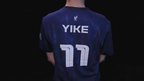 A Man In A Blue Shirt With The Name Yike On The Bottom GIF