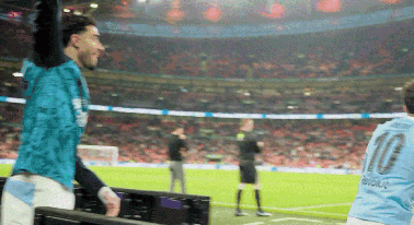 A Man In A Blue Shirt With The Number 10 On It GIF