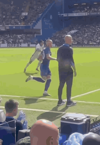 A Man In A Blue Shirt With The Number 10 On It GIF