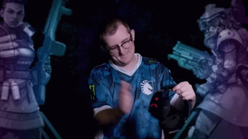 A Man In A Blue Shirt With The Number 8 On It Holds A Headset GIF