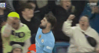 A Man In A Blue Shirt With The Word City On It Is Surrounded By A Crowd GIF