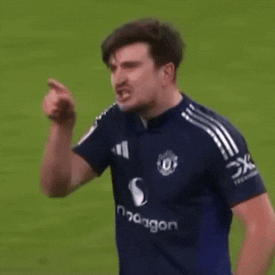 A Man In A Blue Shirt With The Word Dragon On The Front GIF