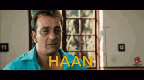 A Man In A Blue Shirt With The Word Haan Written On His Chest GIF