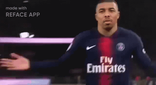 A Man In A Blue Shirt With The Word Paris On It Is Made With Reface App GIF