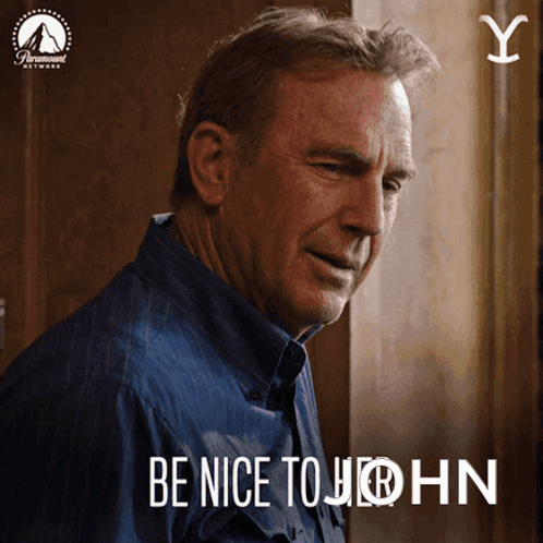 A Man In A Blue Shirt With The Words Be Nice To John GIF