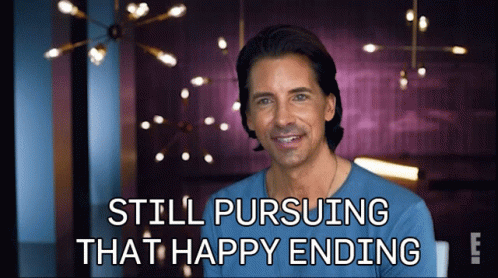 A Man In A Blue Shirt With The Words Still Pursuing That Happy Ending GIF