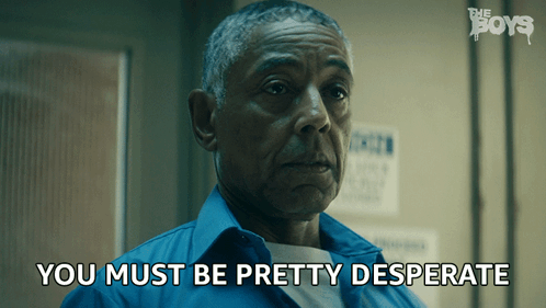 A Man In A Blue Shirt With The Words " You Must Be Pretty Desperate " Next To Him GIF