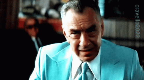 A Man In A Blue Suit And Tie Has The Year 2022 On The Bottom GIF