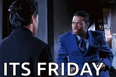 A Man In A Blue Suit And Tie Is Talking To Another Man In A Black Suit And Tie . GIF
