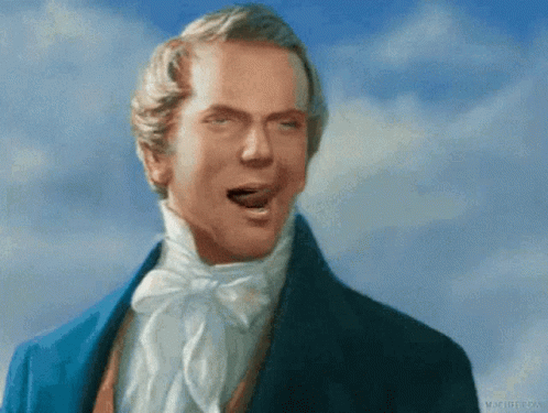 A Man In A Blue Suit Is Making A Face With His Mouth Open GIF