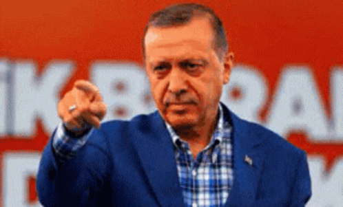 A Man In A Blue Suit Is Pointing His Finger At The Camera GIF