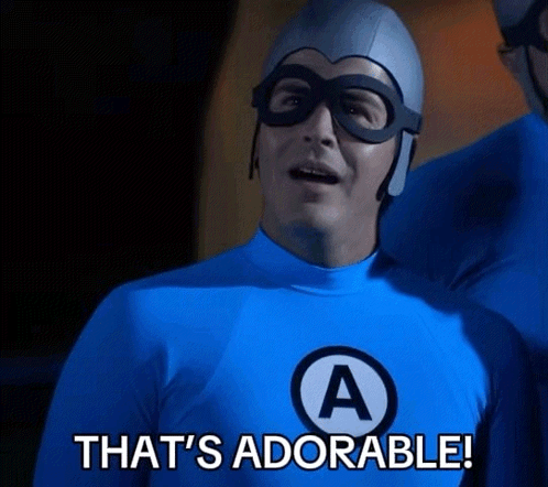 A Man In A Blue Superhero Costume Says " That 'S Adorable " GIF