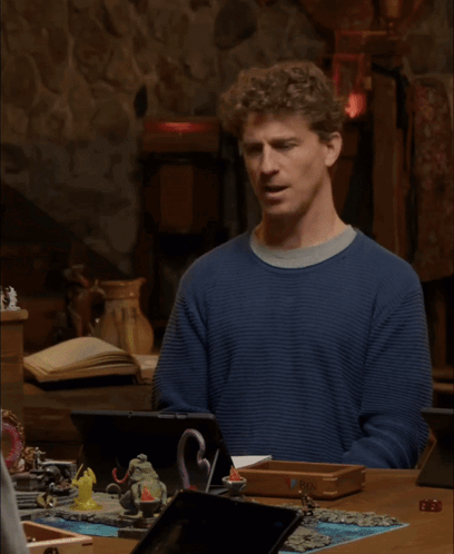 A Man In A Blue Sweater Says I 'M Sorry What GIF