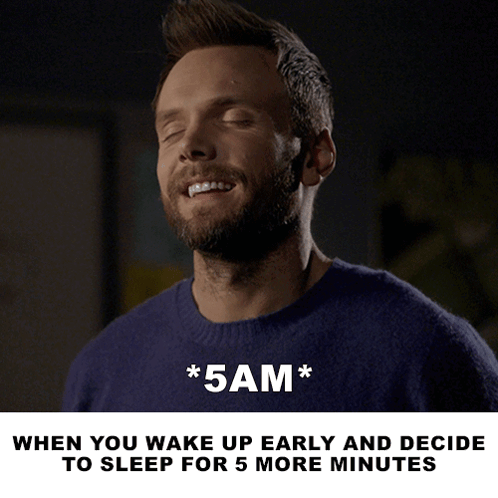 A Man In A Blue Sweater With His Eyes Closed And The Words * 5Am * Below Him GIF