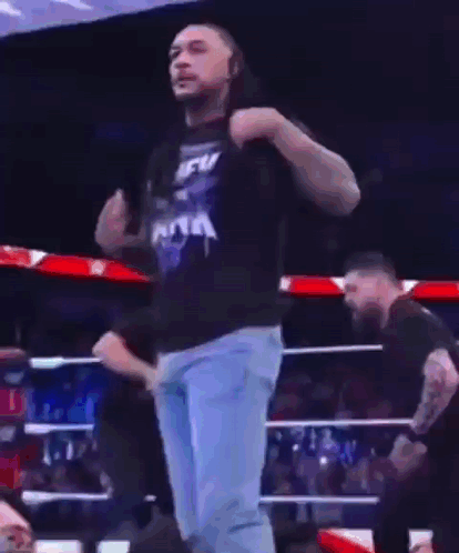 A Man In A Blue T-Shirt That Says New York Is Dancing In A Ring GIF