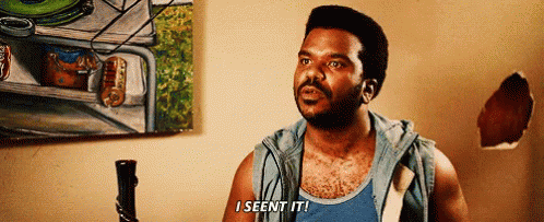 A Man In A Blue Tank Top Says I Seen It In Front Of A Painting GIF