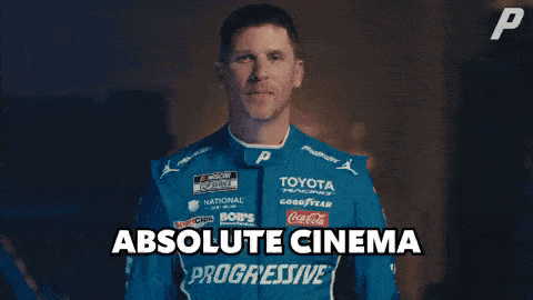 A Man In A Blue Toyota Racing Suit Is Giving A High Five GIF