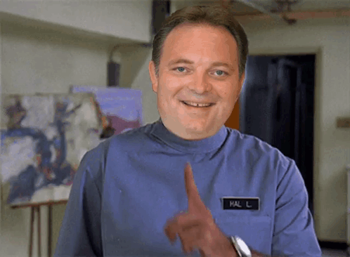 A Man In A Blue Uniform Has A Name Tag That Says Mal L On It GIF