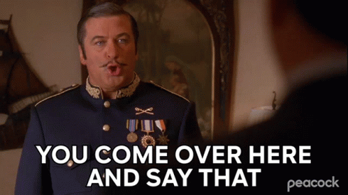 a man in a blue uniform says you come over here and say that