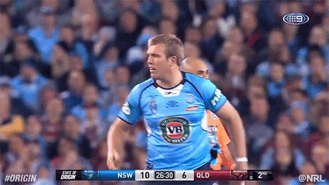 A Man In A Blue Vb Jersey Stands In Front Of A Crowd During A Rugby Game GIF
