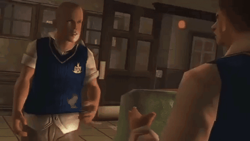 A Man In A Blue Vest With A Crest On It Stands Next To Another Man GIF