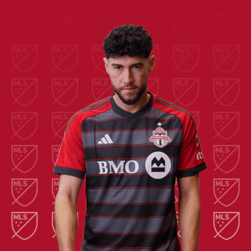A Man In A Bmo Jersey Holds A Red Card GIF