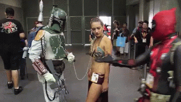 A Man In A Boba Fett Costume Is Holding A Woman In A Leia Costume GIF
