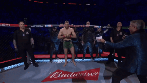 A Man In A Boxing Ring Holds A Sign That Says Western Australia GIF