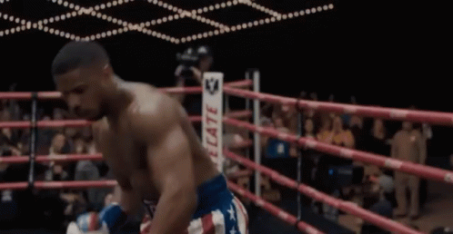 A Man In A Boxing Ring Wearing A Belt That Says ' Reed ' On It GIF