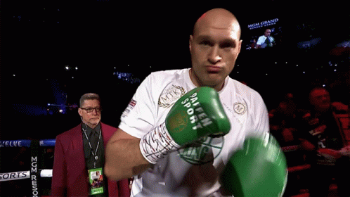 A Man In A Boxing Ring Wearing A Shirt That Says Mgm Grand On It GIF