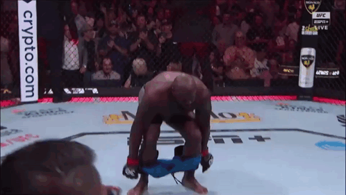 A Man In A Boxing Ring With A Crypto.com Advertisement In The Background GIF
