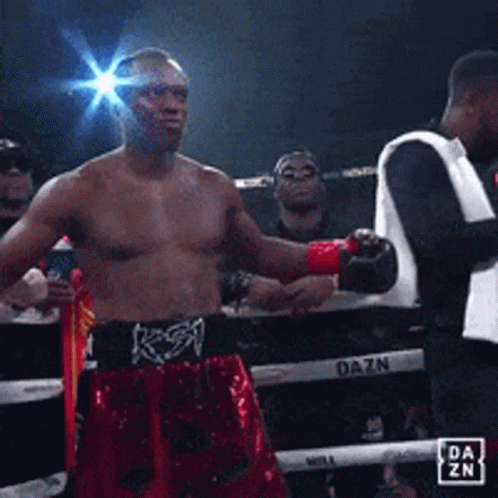 A Man In A Boxing Ring With A Dazn Logo GIF