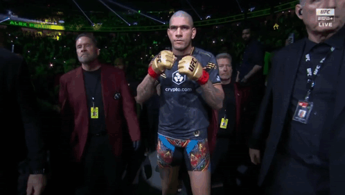 A Man In A Boxing Ring With A Ufc Logo On His Arm GIF