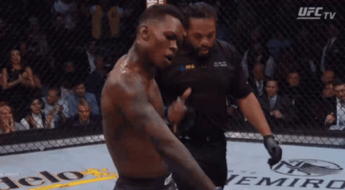 A Man In A Boxing Ring With A Ufc Tv Logo In The Corner GIF