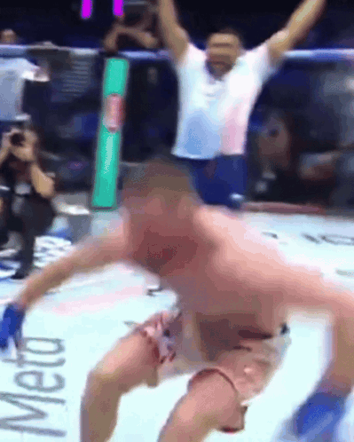 A Man In A Boxing Ring With The Word Meto On The Wall GIF