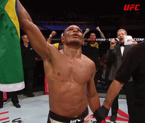 A Man In A Boxing Ring With The Word Ufc In The Background GIF