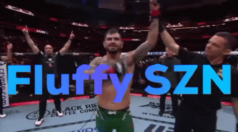 A Man In A Boxing Ring With The Words Fluffy Szn In Blue Letters GIF